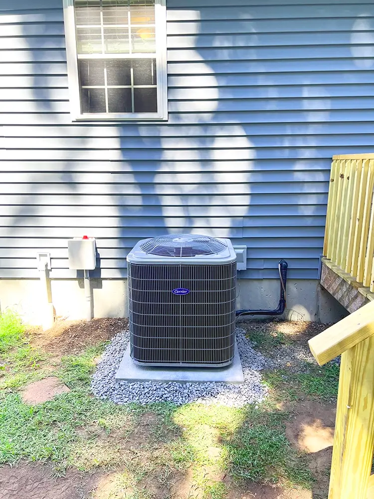 Outdoor installation of Carrier A/C unit by National Refrigeration 