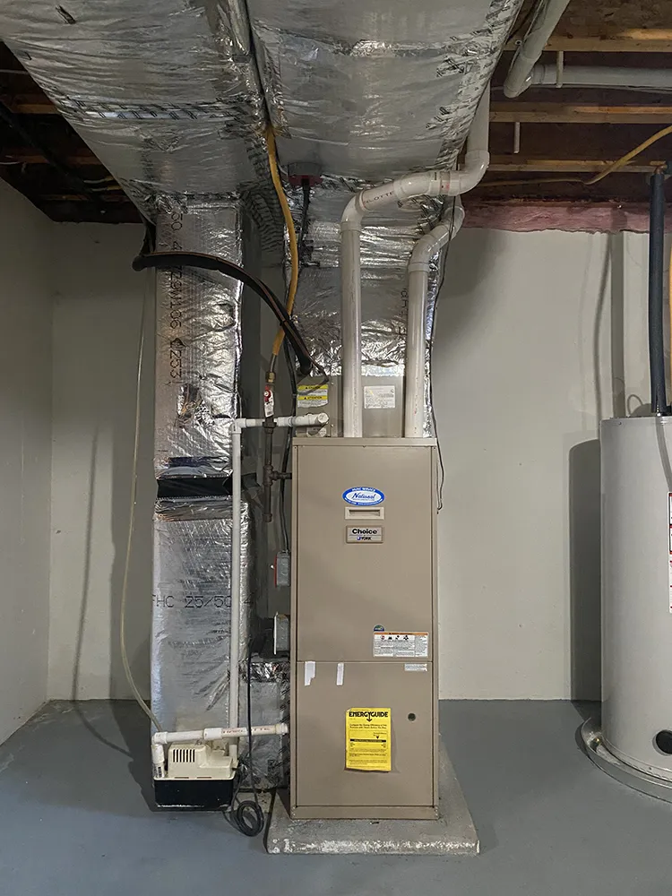  These Rhode Island homeowners contacted National Refrigeration of Warwick to replace this outdated furnace