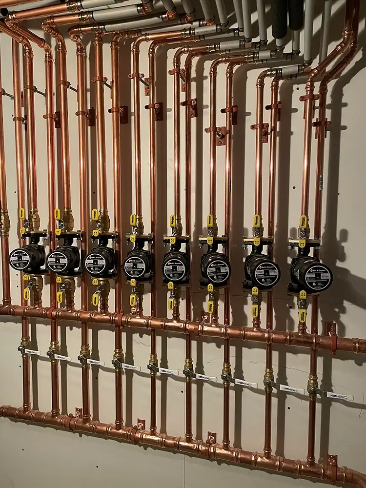 Close-up of zoned copper piping for new Lochinvar boiler system