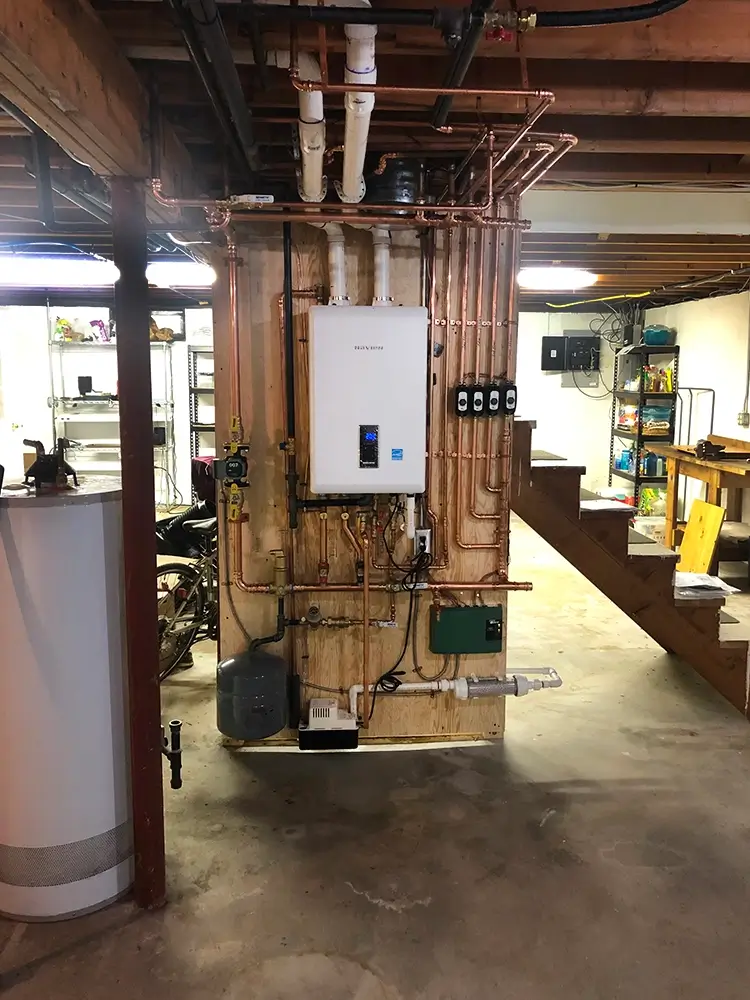 Compact, wall-mounted Navien boiler installation by National Refrigeration of RI