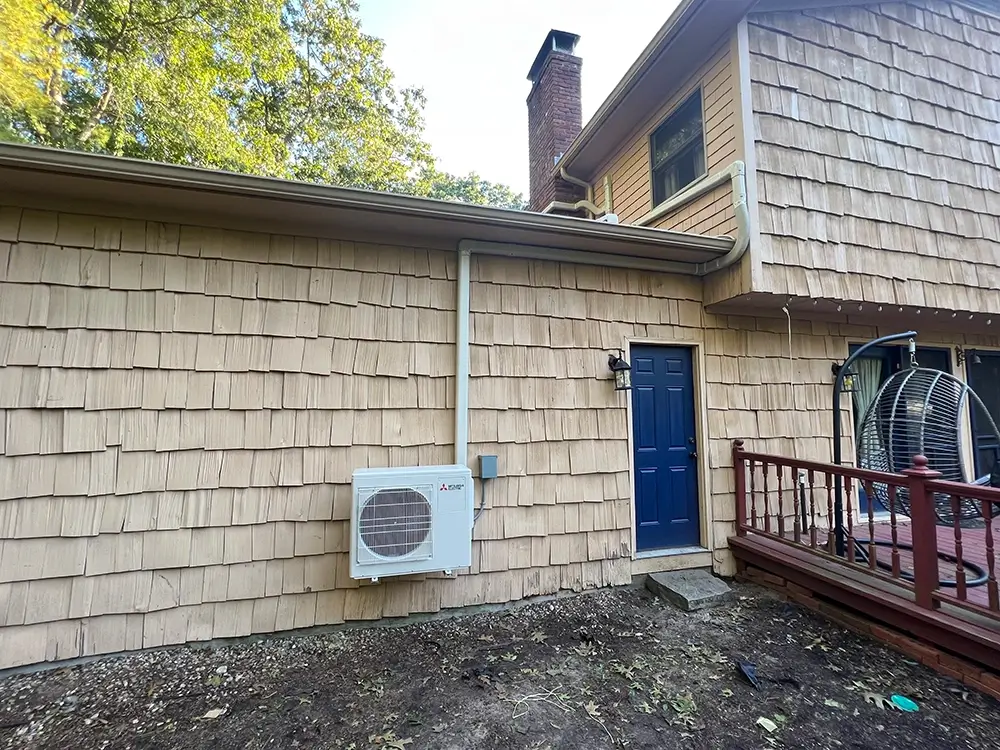 Mitsubishi heat pump installed outside a home in Coventry, Rhode Island